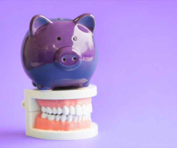 Piggy bank representing dental savings