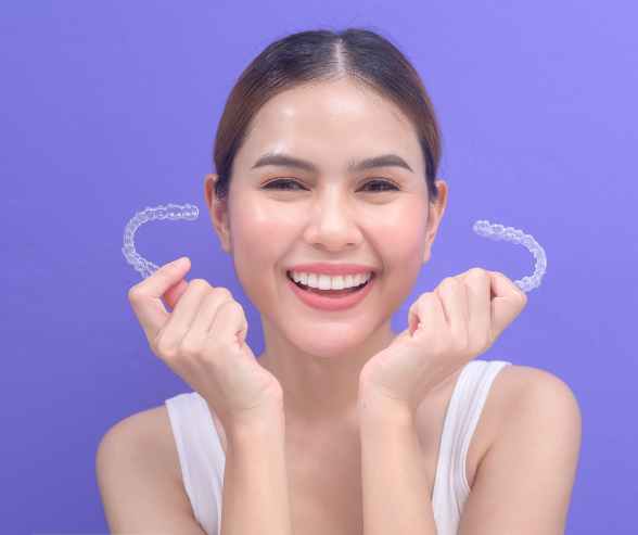 Woman wearing Invisalign clear aligners
