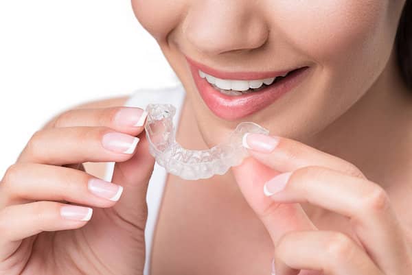 Young woman with clear ceramic braces